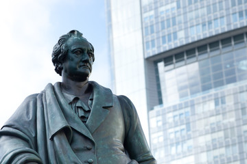 Goethe statue at Goetheplatz in Frankfurt with skyscraper