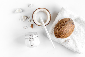 Fototapeta premium organic cosmetics with coconut on white background top view