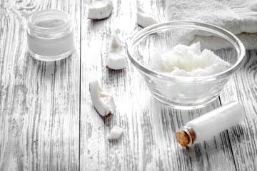 organic cosmetics with coconut on wooden background close up