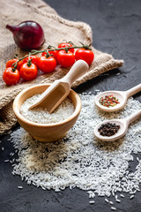 ingredients for paella on dark background