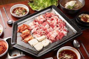 grilled beef brisket. It's a korean style table.	