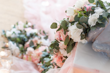 Flowers. Decoration of wedding table in ivory colors