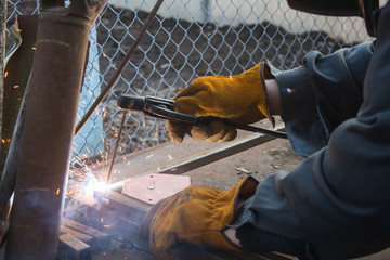 Welder working a welding metal