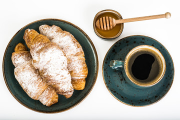 Fresh warm croissants on white background