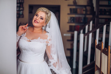 young bride portrait with perfume is getting ready at home in the morning, wedding day
