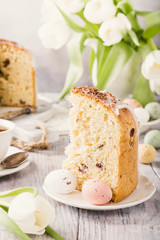 Slice of easter orthodox sweet bread, kulich end quail eggs. Holidays breakfast. Retro style toned.
