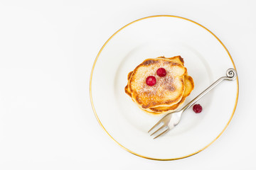Delicious pancakes with berries and yogurt.