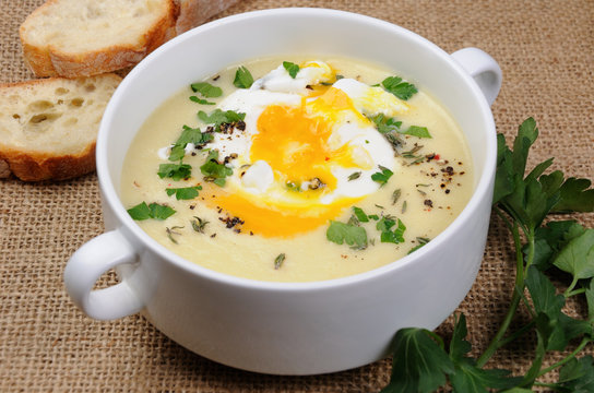 potato cream soup with poached eggs