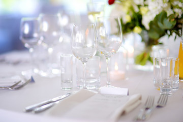 Beautiful table setting with crockery and flowers for a party, wedding reception or other festive event