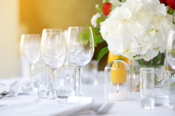 Beautiful table setting with crockery and flowers for a party, wedding reception or other festive event