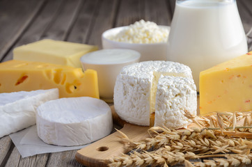 Fresh dairy products. Milk, cheese, brie, Camembert, butter, yogurt, cottage cheese and eggs on...