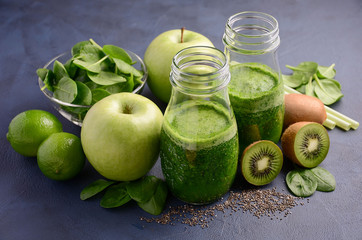 Healthy green smoothie with kiwi, apple, spinach and chia seeds.