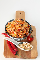 Delicious vegetarian quinoa salad with bell pepper, cucumber and tomatoes