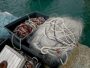 Fishing nets of nylon and other materials in the quay. 