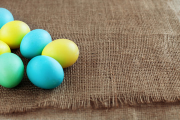 Background with colored eggs for greeting. The concept of a happy Easter.