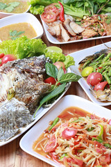 Mix Thai food on wooden floor in Thailand style.