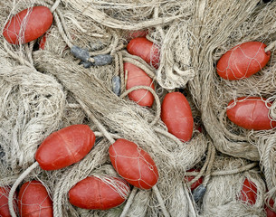 Fishing net with red cork floats. 