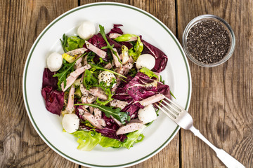 Salad mix with sausage, mozzarella, chia seeds