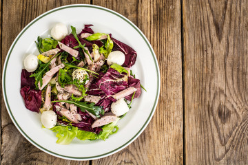 Salad mix with sausage, mozzarella, chia seeds
