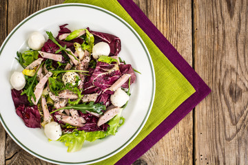 Salad mix with sausage, mozzarella, chia seeds