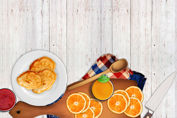 Cutting board, fruits, oranges, knife, wine, juice
