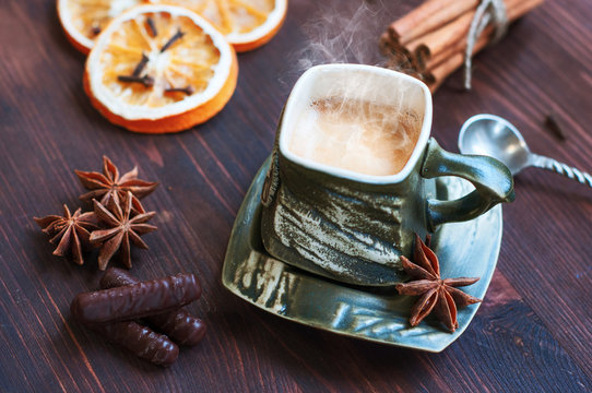cup of coffee with grief spice star anise and cinnamon