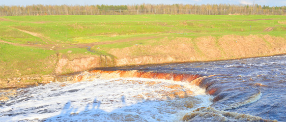 Small waterfall on river.