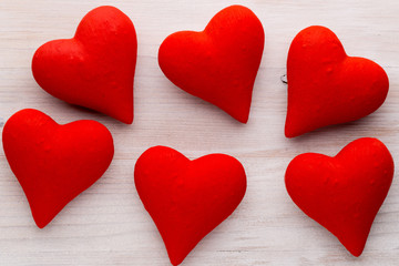 Naklejka na ściany i meble Red hearts the gray background. Valentine Day background.