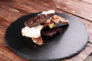 Melting chocolate and diffrent bars - stack and chips with chocolate swirl/ powder and cocoa pod with melted chocolate