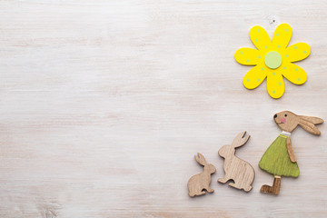 Spring and Easter decor. Wooden symbols bunny, flowers and butterflies.