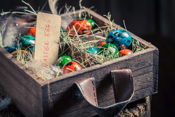 Colourfull Easter eggs in wooden small box