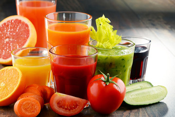 Glasses with fresh organic vegetable and fruit juices