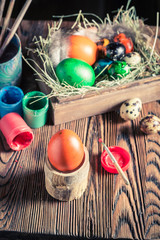Preparing Easter eggs with hay and feathers