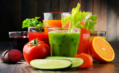 Glasses with fresh organic vegetable and fruit juices