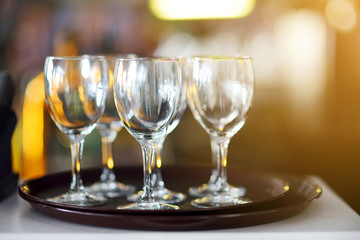 Lots of wine glasses during some festive event
