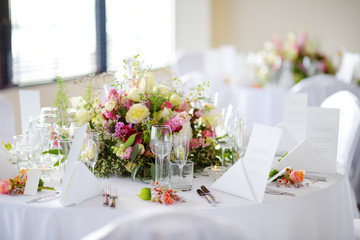 Beautiful table setting with crockery and flowers for a party, wedding reception or other festive event