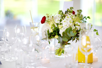 Beautiful table setting with crockery and flowers for a party, wedding reception or other festive event