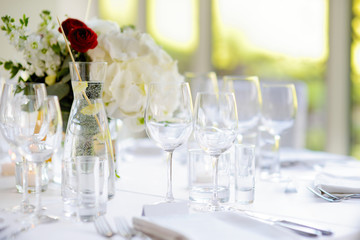 Beautiful table setting with crockery and flowers for a party, wedding reception or other festive event