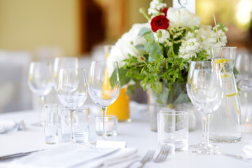 Beautiful table setting with crockery and flowers for a party, wedding reception or other festive event