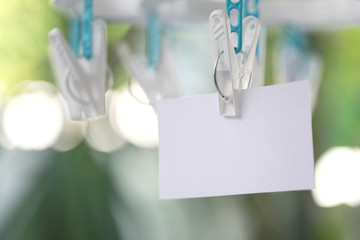 white paper notes hanging in a clothesline.