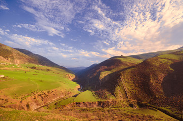 Beautiful landscape in the mountains with the sun at dawn. Mountains at the sunset time....