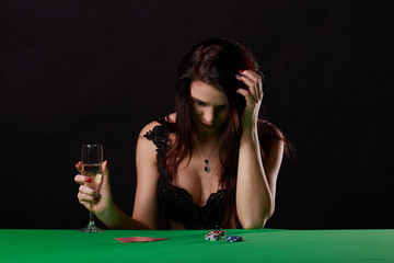 Fototapeta na wymiar pretty young woman gambling on green table