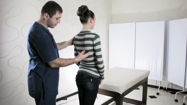 Doctor chiropractor gropes patient's spine girls