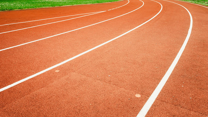Red running track in stadium.