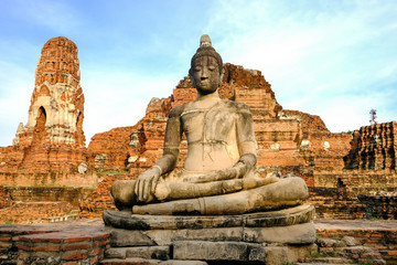 Fototapeta na wymiar Statues in front of the pagoda Wat Mahathat, Ayutthaya Province, Thailand
