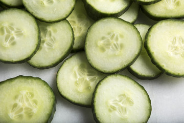 Macro view Healthy Cut Cucumber slices on white background