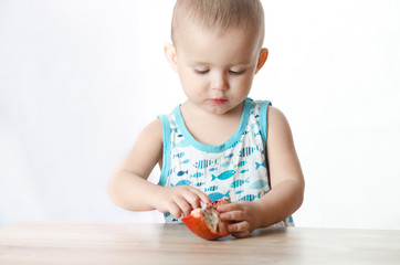A child eating a pomegranate