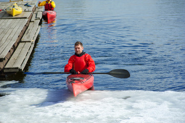 man kayaking on a red kayak on excursions in nature 05