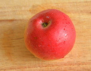 Red apple on wooden.