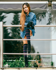 Fashionable pretty young woman wearing striped knee socks